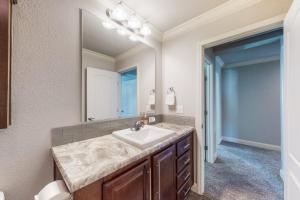 a bathroom with a sink and a mirror at Quail Nest on Quail Drive in Fraser +58 photos