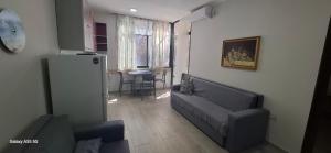 a living room with a couch and a table at Pine Apartment 2 plus 1 in Golem