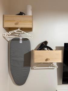 a computer mouse is hanging from a shelf at Marina Spatial Condo Unit 16 MountainView Studio in Piapi