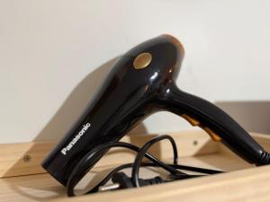 a black phone sitting on top of a desk at Marina Spatial Condo Unit 16 MountainView Studio in Piapi