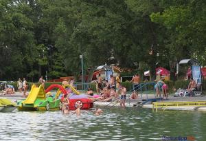 a group of people in the water at a water park at Levendula Vendégház in Balatonföldvár