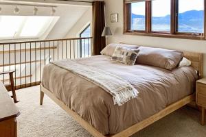 a bedroom with a large bed with two pillows on it at Railbender 8 in Fraser +59 photos