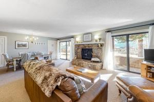 a living room with a couch and a fireplace at Ponderosa 2A Permit #3,01630 in Crested Butte