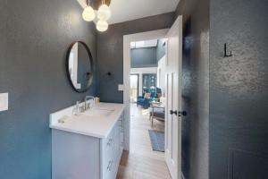 a bathroom with a sink and a mirror at Mountain View Retreat in Durango +62 photos
