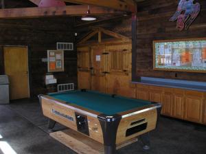 a ping pong table in a room with at Mount Vernon Camping Resort Studio Cabin 4 in Bow