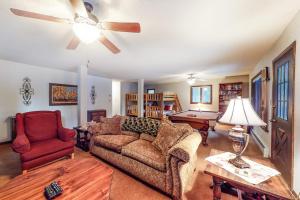 a living room with a couch and a ceiling fan at Alpine Bliss in Durango