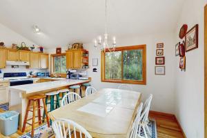 a kitchen with a table and some chairs and a counter at Lucky Bear's Lair in Fairplay