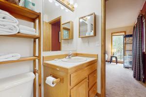 a bathroom with a sink and a mirror at Lucky Bear's Lair in Fairplay +47 photos