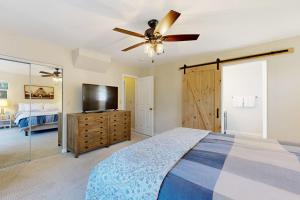 a bedroom with a bed and a ceiling fan at Edwards Escape in Edwards