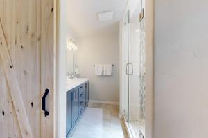 a bathroom with a blue cabinet and a sink at Edwards Escape in Edwards +41 photos