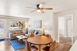 a living room with a table and a couch at First Tracks 4105 in Steamboat Springs
