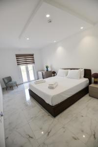 a bedroom with a large bed in a room at B6 Dahlet Ta Cenc in Sannat +77 photos