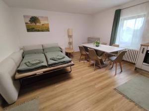 a living room with a couch and a table at Apartmán Kozolupy in Kozolupy