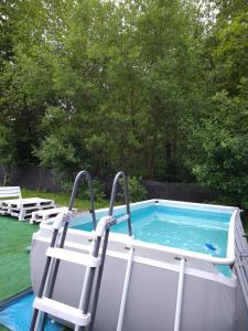 a pool with lounge chairs and a poolificialificialificialificialificialificialificialificial at evkalipt in Ivano-Frankivsk +15 photos