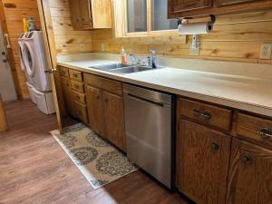 a kitchen with a sink and a dishwasher at Rio Grande Lodge in South Fork +76 photos
