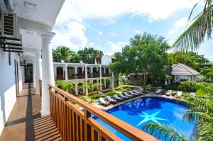 a balcony view of a house with a swimming pool at Peacock Wild YALA in Tissamaharama