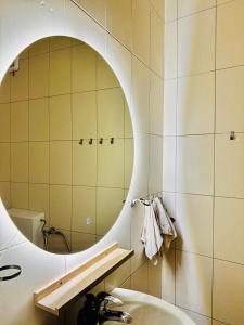 a bathroom with a sink and a mirror at Budva Sky Sea - View Point in Budva +83 photos