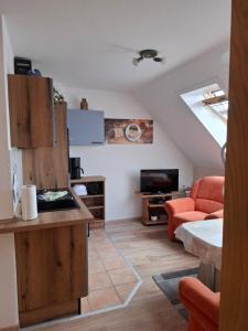 a room with a kitchen and a living room at Fewo Abendsonne in Ueckeritz