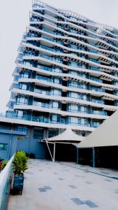 a large apartment building with a patio in front of it at Greenland HomeINN in Kigali