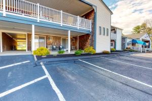 an empty parking lot in front of a building at Seafarer Resort-Unit 107 in Ogunquit