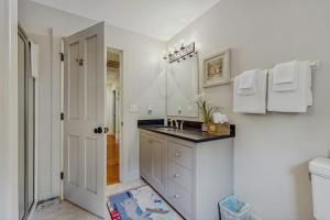 a white bathroom with a sink and a toilet at Beech Hill Lodge in Freeport +53 photos
