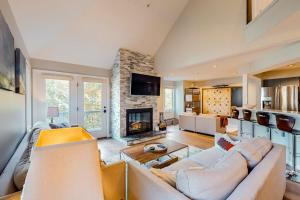 a living room with a couch and a fireplace at Après Chalet in Newry
