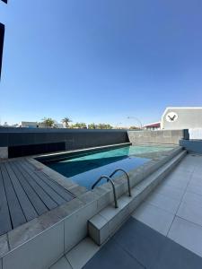 a swimming pool on top of a building at MariSal at 77 Independence avenue CBD in Windhoek