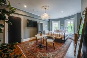 a living room with a couch and a table at The Concord Hotel in Boston