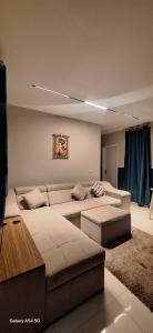 a living room with a couch and a table at Elite Apartment In Cairo Downtown in Cairo