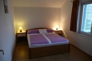 Postel nebo postele na pokoji v ubytování Apartments Toni, Borik