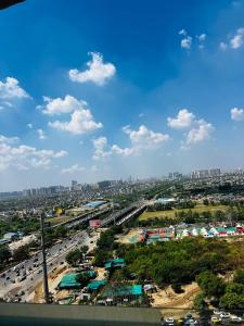 an overhead view of a city with traffic on a highway at THE MOONLIGHT STUDIo in Ghaziabad