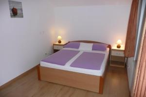 Postel nebo postele na pokoji v ubytování Apartments Toni, Borik