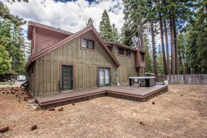 a house with a grill in front of a yard at Bonanza By Hauserman Rentals in Tahoe City
