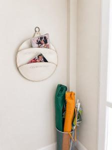 a mirror hanging on a wall with toothbrushes at La Costa Rooms in Flumini di Quartu +51 photos