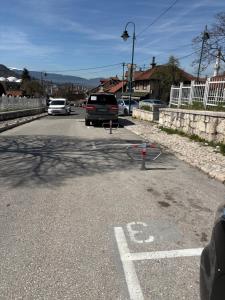 a car is parked in a parking lot at Mills Apartment, Baščaršija-Stari Grad in Sarajevo