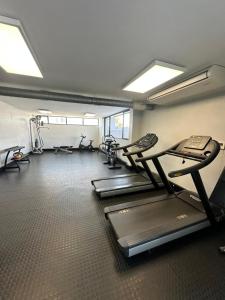 a gym with treadmills and ellipticals in a room at MariSal at 77 Independence avenue CBD in Windhoek