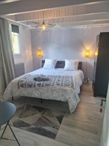 a bedroom with a large bed in a room at Calme et quiétude in Saint-Vivien-de-Blaye