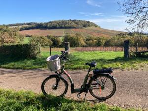 a bike parked on the side of a road at L'Atelier du Champ Ladoit in Mercurey