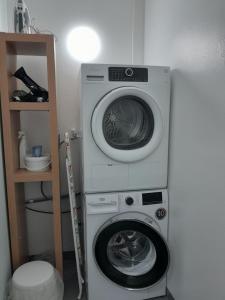 a washing machine and a washer in a room at Guesthouse in Ólafsvík