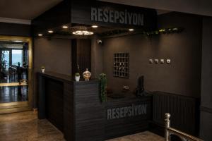 a restaurant with a reception desk in a room at Dolphins Otel in Akçakoca +24 photos