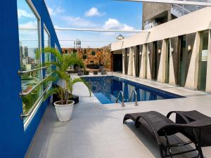 a balcony with a pool on a building at The District Hotel in Panama City