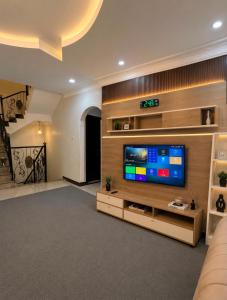 a large living room with a flat screen tv at فلة الضيافة المميزة Dhiafa Villa in Dammam