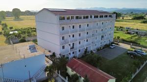 an overhead view of a large white building at Jasmine Apartments in Velipojë