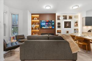 a living room with a couch and a dining room at Widmr Residences in Toronto +290 photos