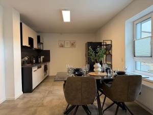 a kitchen and dining room with a table and chairs at APARTMENT in Hambach in Hambach