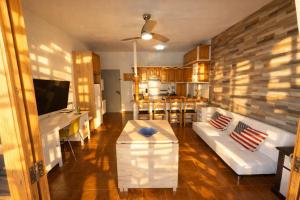 a living room with a couch and a table at candelaria Quiet 2bedroom Apartment near the Sea FAST WIFI FAST WIFI in Candelaria