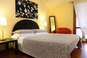 A bed or beds in a room at Claudio Appartamenti