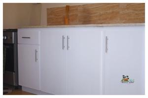 a white cabinet with a counter on top of it at Island View Estate in Kingstown