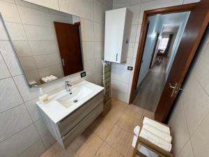 a bathroom with a sink and a mirror at Casa Rosales in La Orotava +18 photos