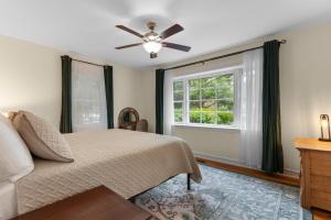 a bedroom with a bed and a window at The Brick House Georgetown in Georgetown